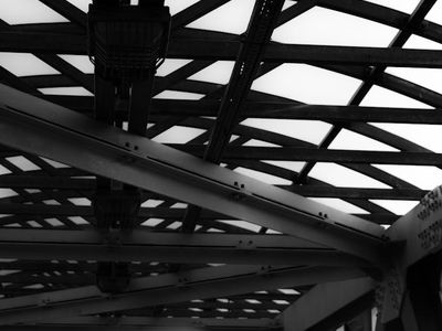 Cyan glowing lines in darkness showing structural integrity